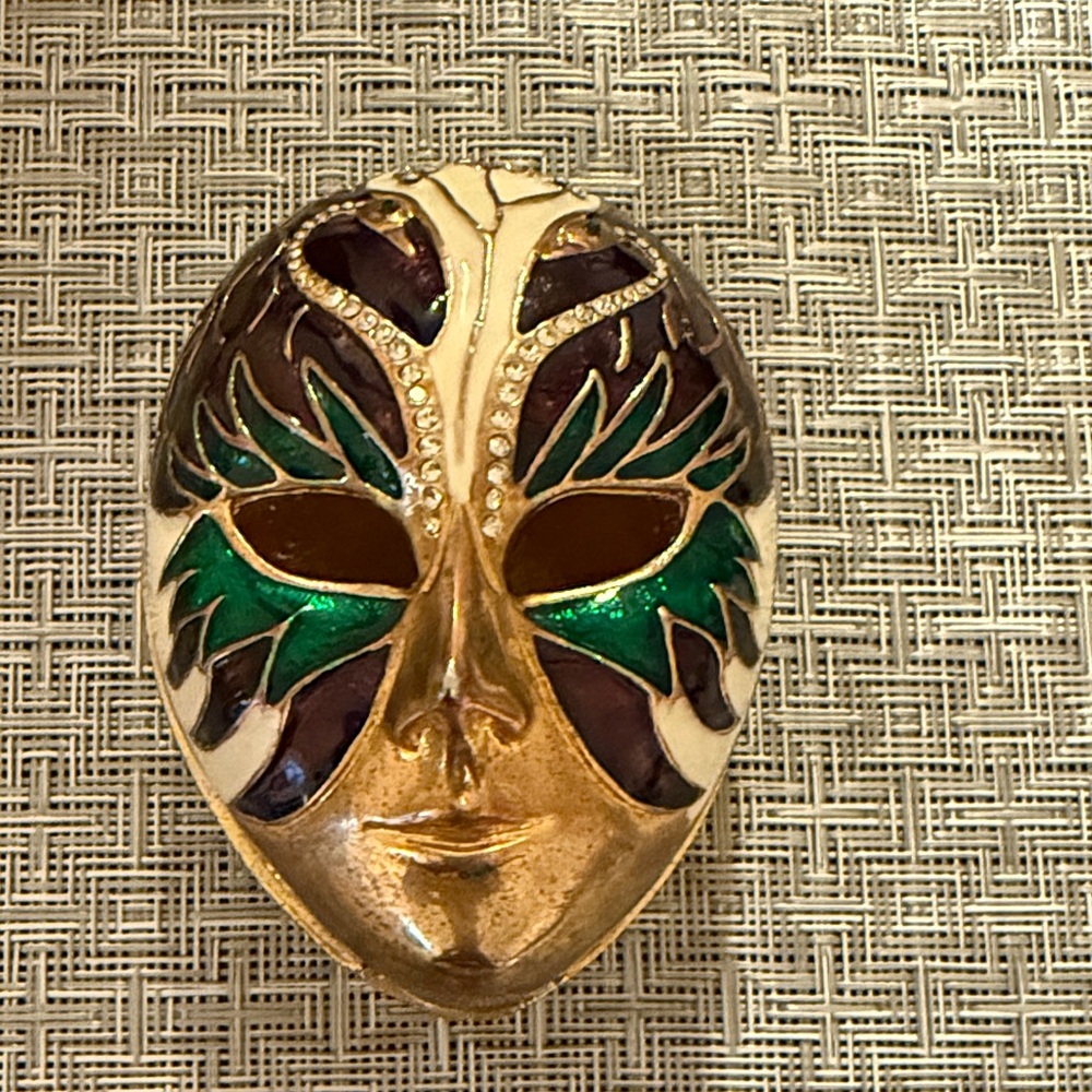Mardi Gras Gold and Green Decorative Mask 
Brasslike with magnets for closure.